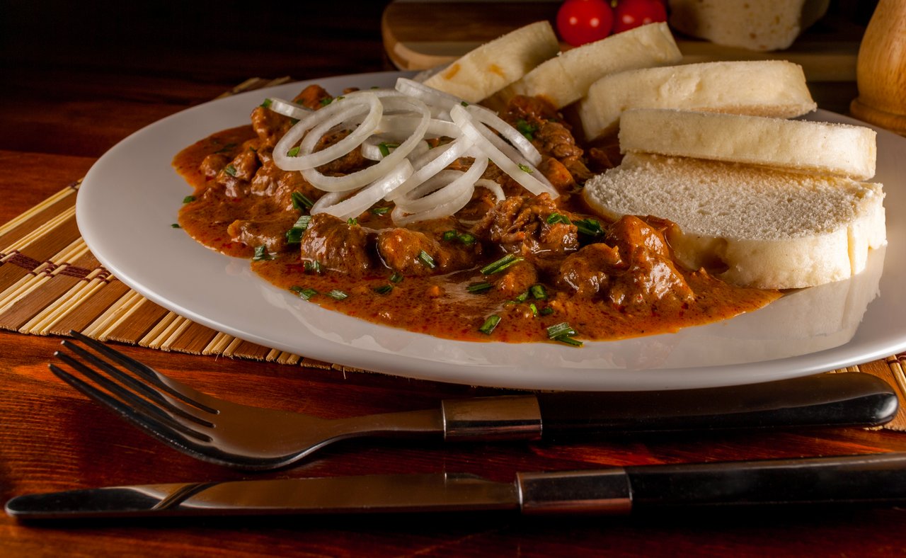 A plate of Czech goulash with dumplings