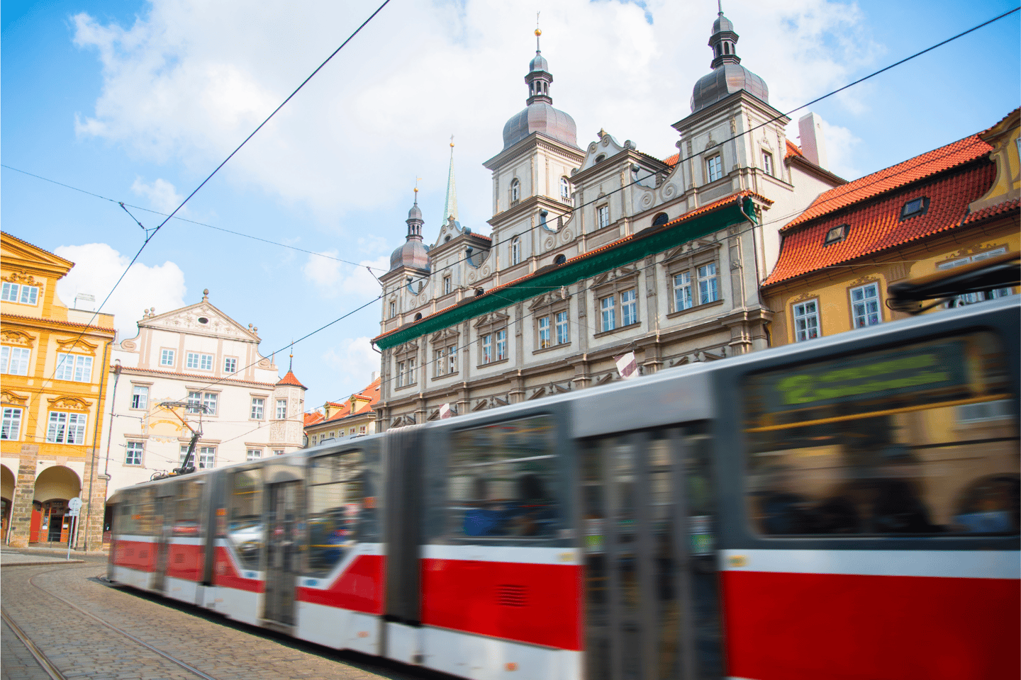A Prague tram moving in a square of the city centre.