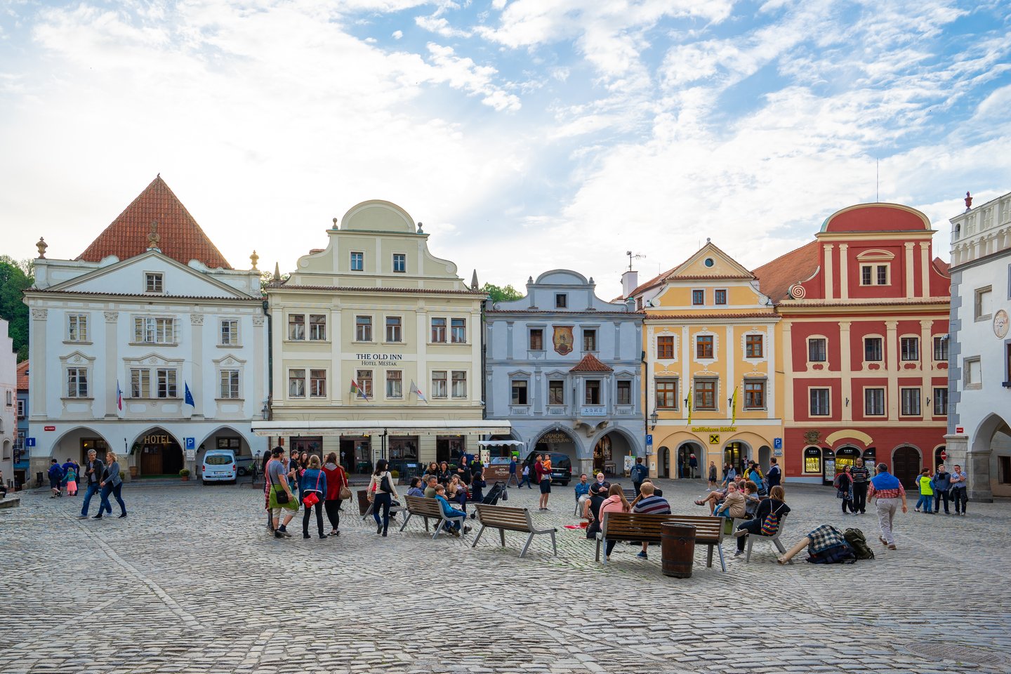 People sitting in the Old Town Square of Cesky Krumlov