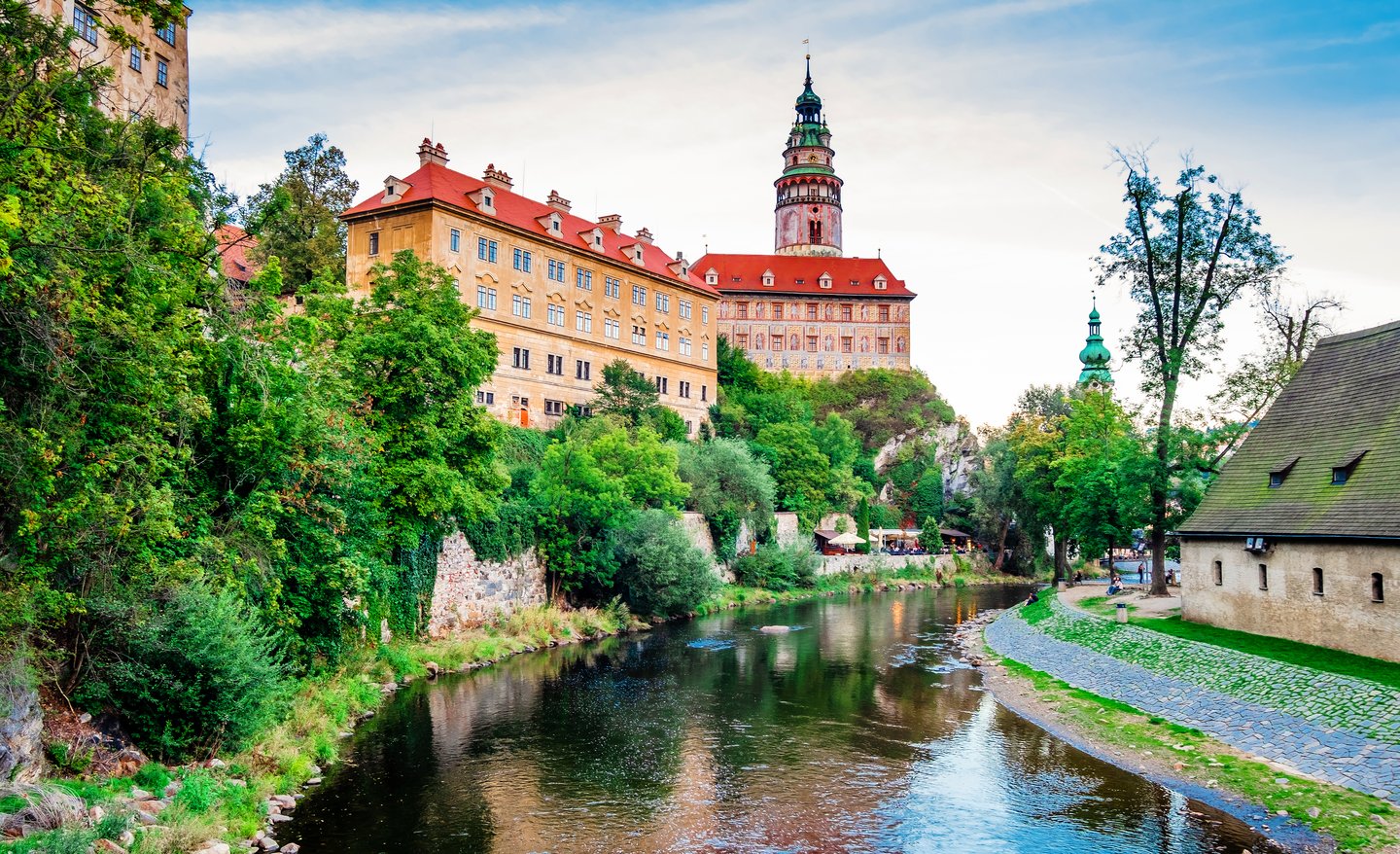 Old architecture and trees near river bay of Cesky Krumlov, Czechia