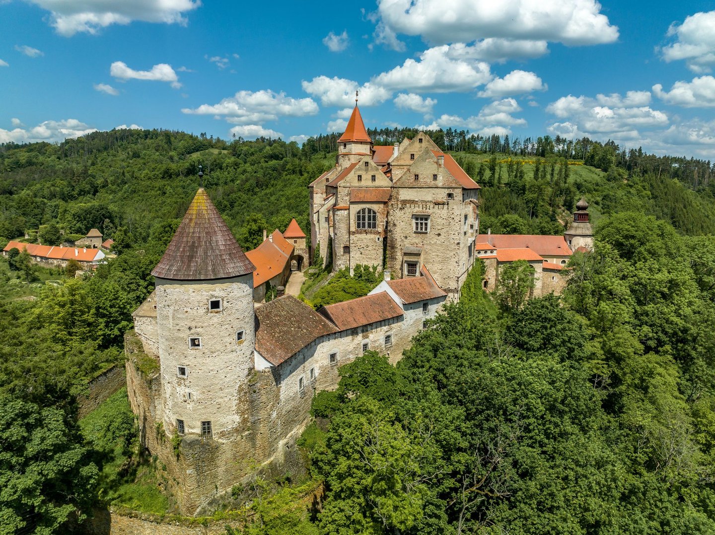 Pernštejn Castle surrounded by trees in Moravia in the Czech Republic.