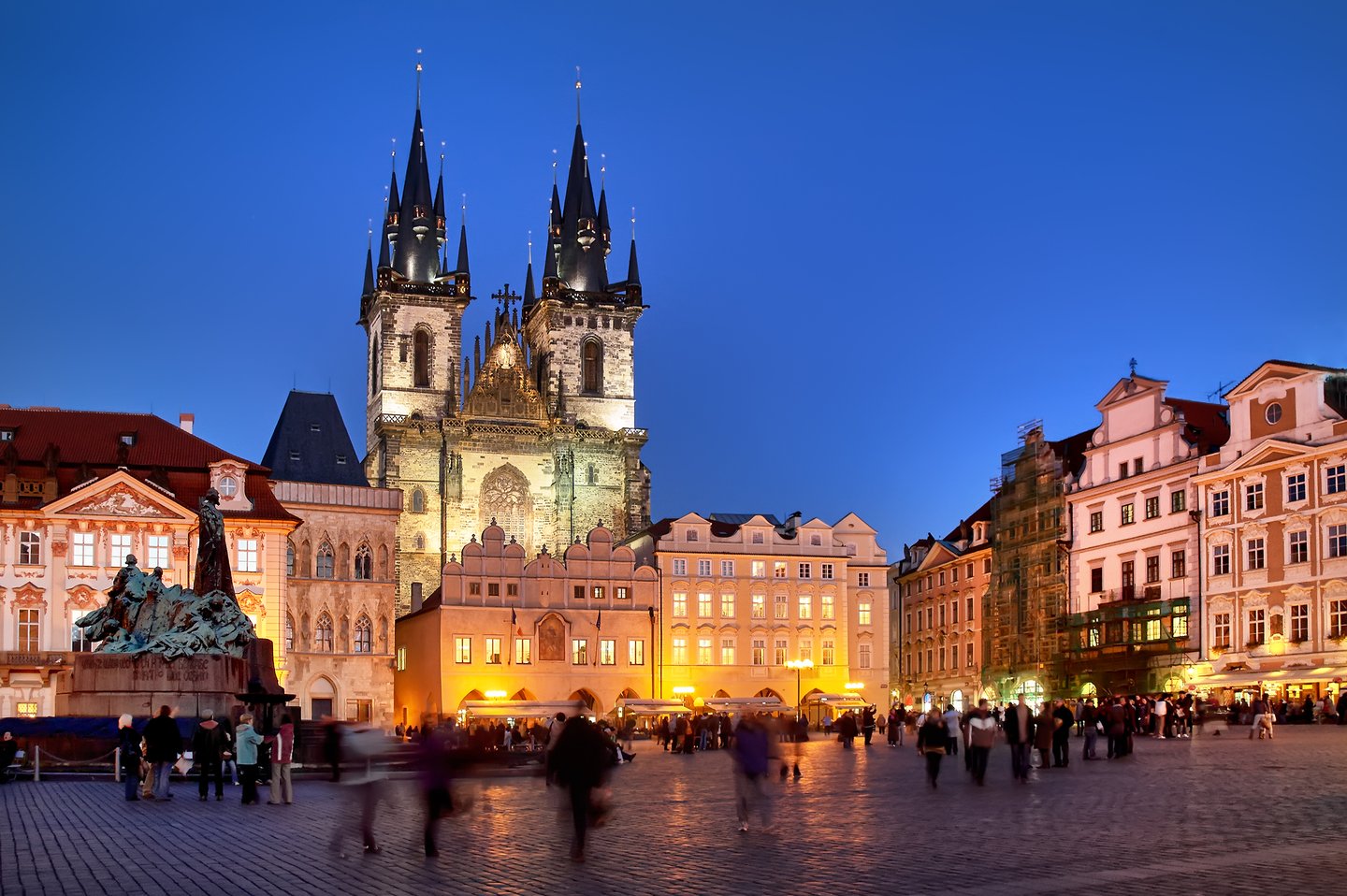 People in the square in front of the Church of Our Lady in Prague at night