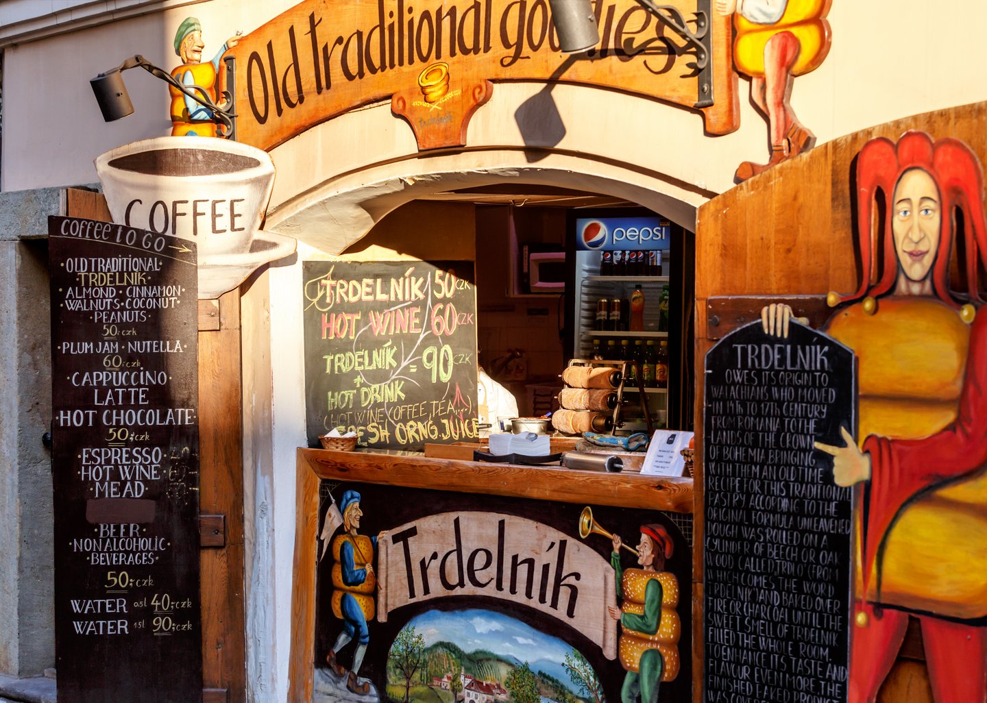 A traditional trdelnik shop with medieval-style paintwork in Prague