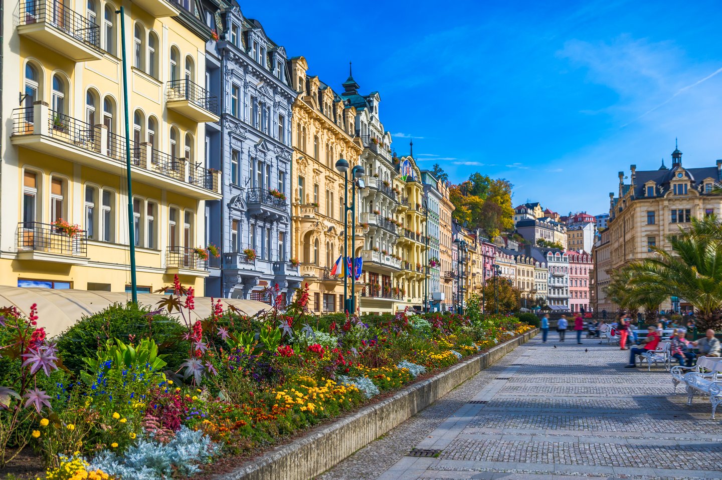 Historic buildings in pastel colours in the old town of Karlovy Vary.
