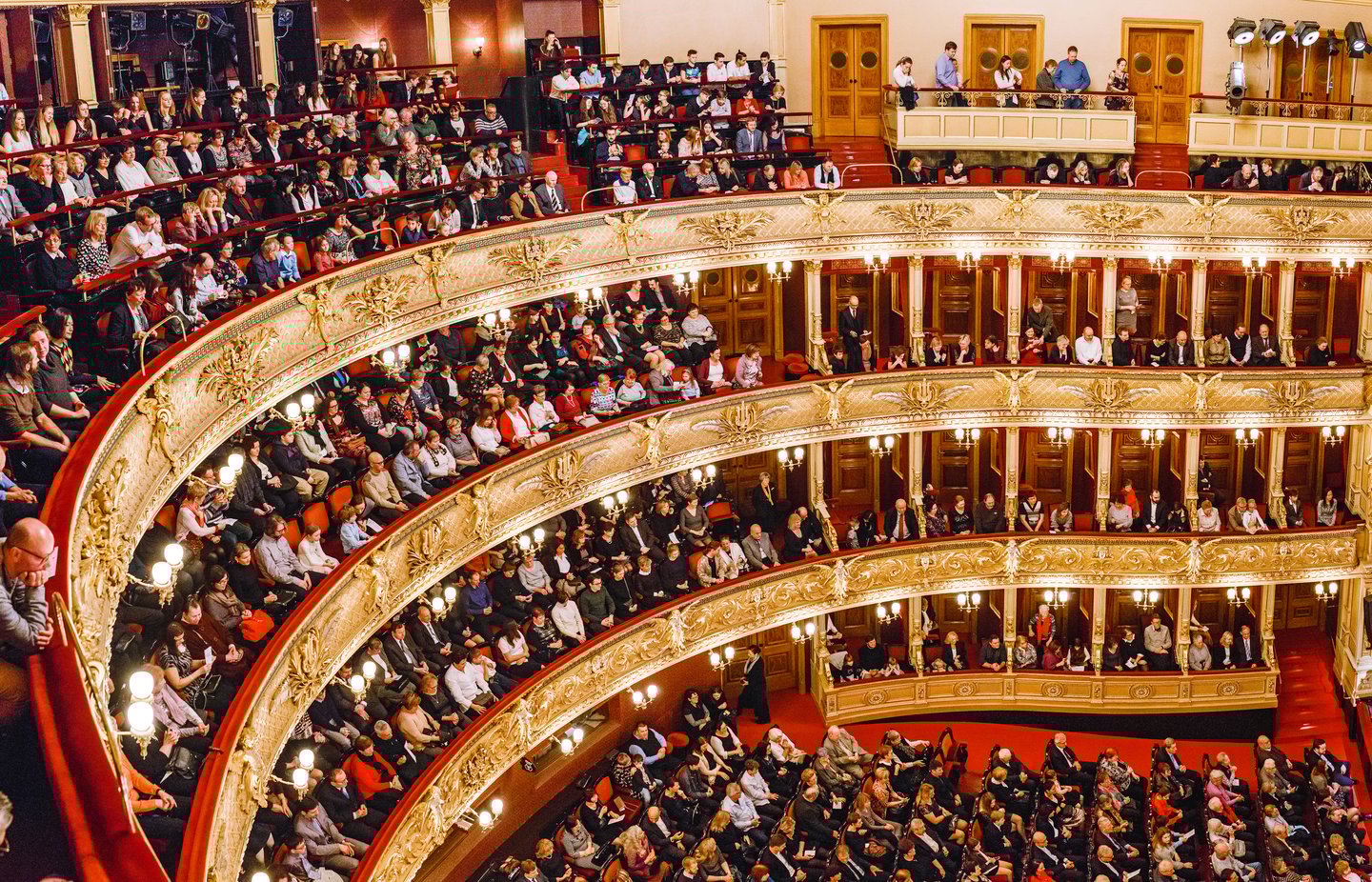 People watching a performance at the National Theatre in Prague.