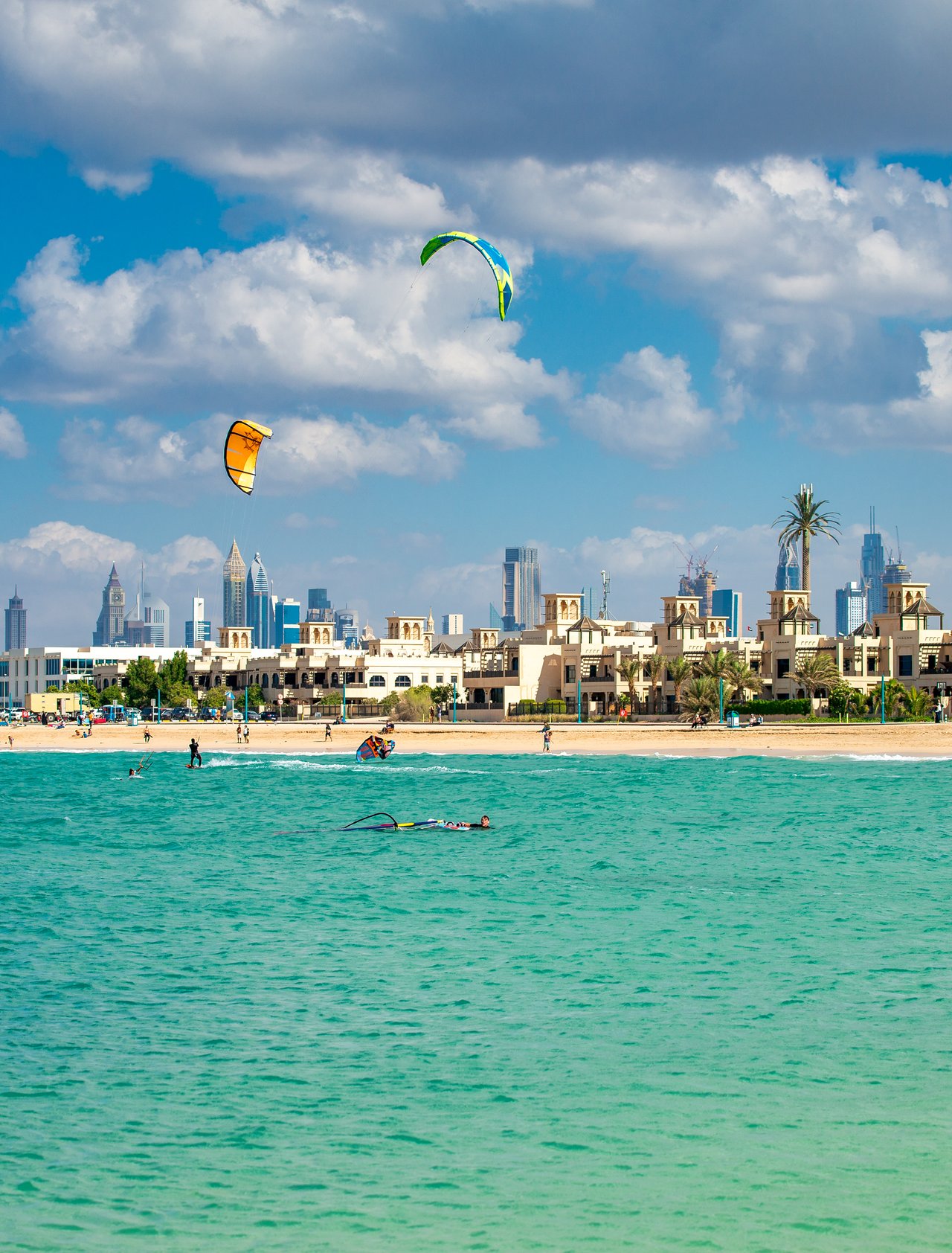 People enjoying watersports at Kite Beach, Dubai on a sunny day