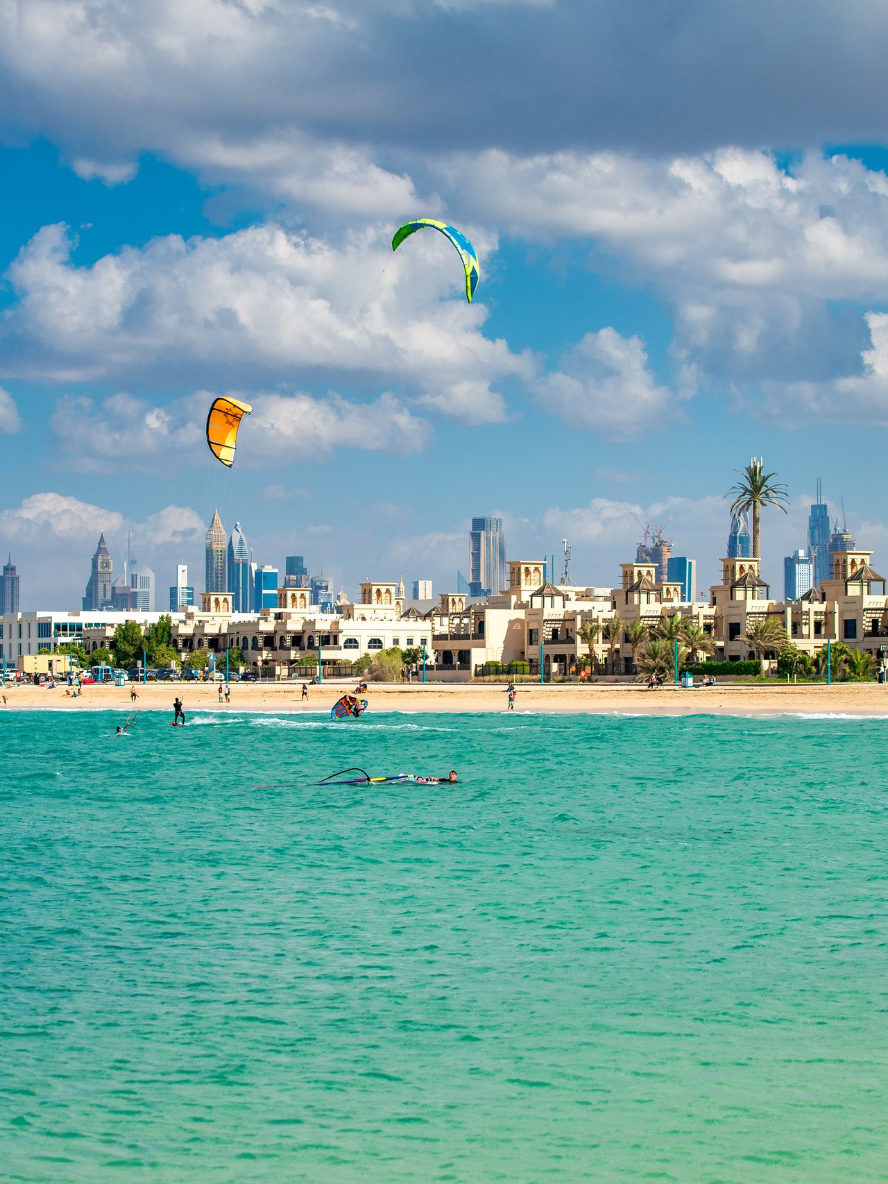 People enjoying watersports at Kite Beach, Dubai on a sunny day