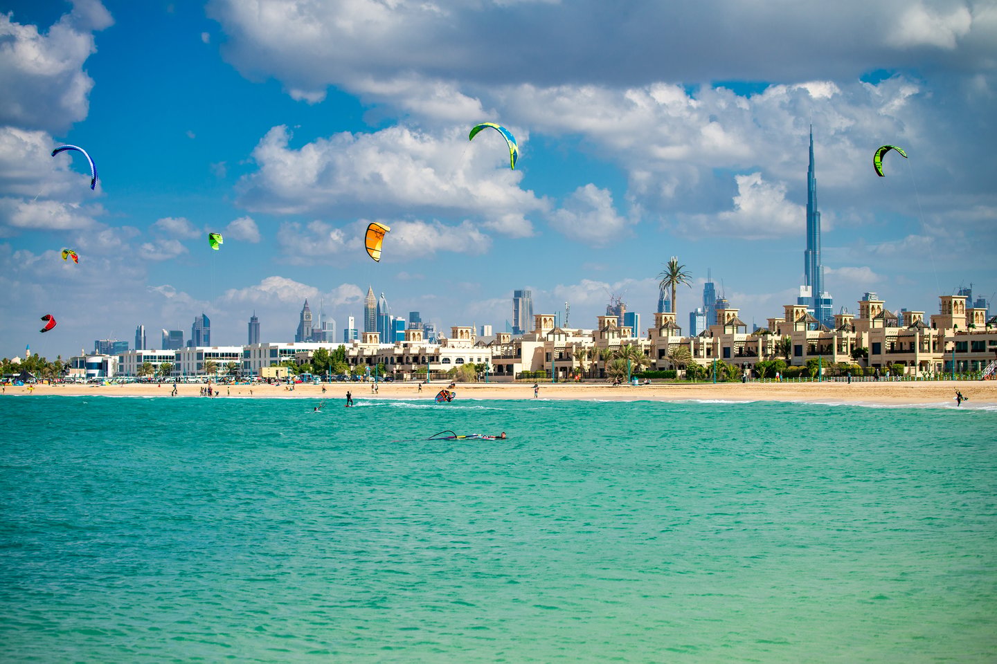 People enjoying watersports at Kite Beach, Dubai on a sunny day