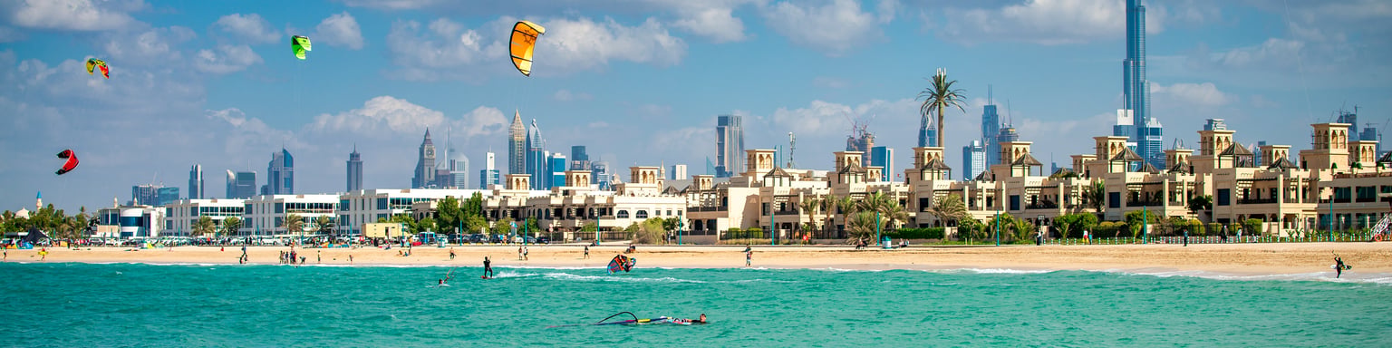People enjoying watersports at Kite Beach, Dubai on a sunny day