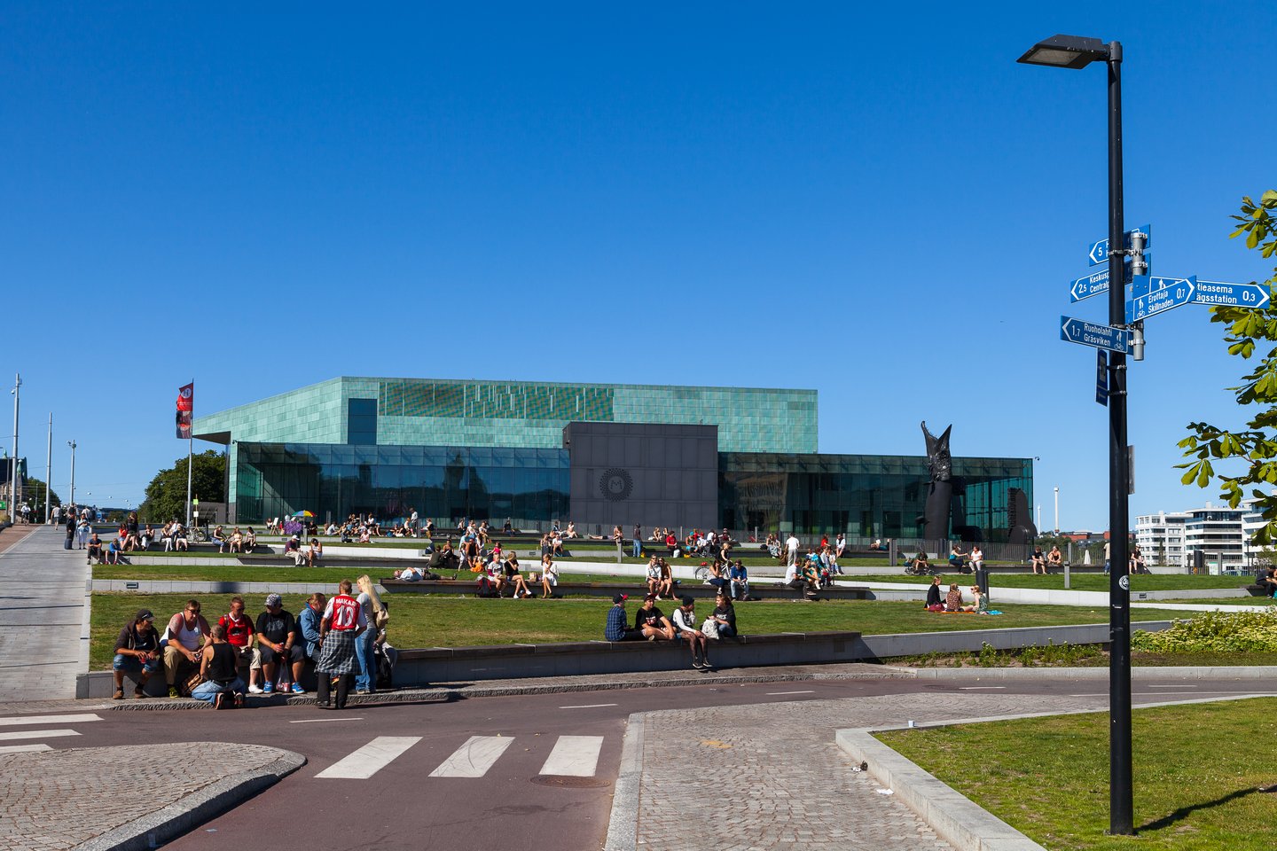 People relaxing in a park on a summer's day