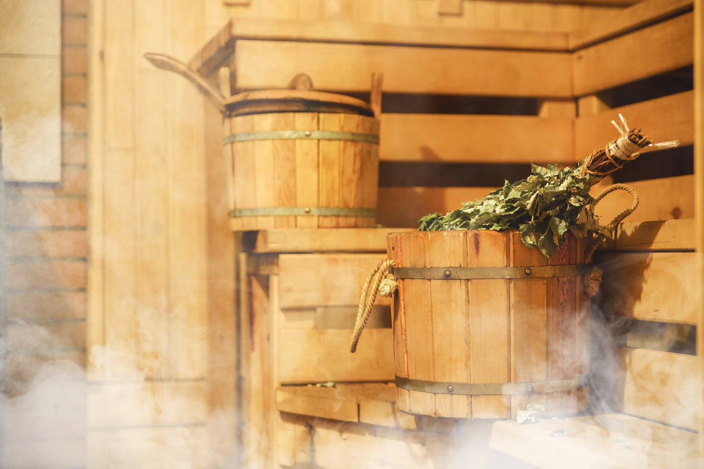 Buckets and steam inside a Finnish sauna