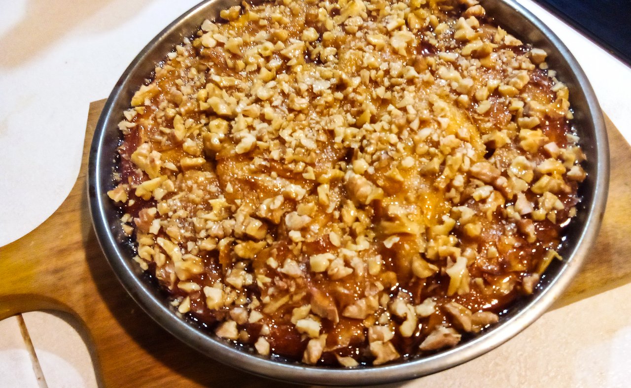 A freshly made pacavure cooling on a wooden board