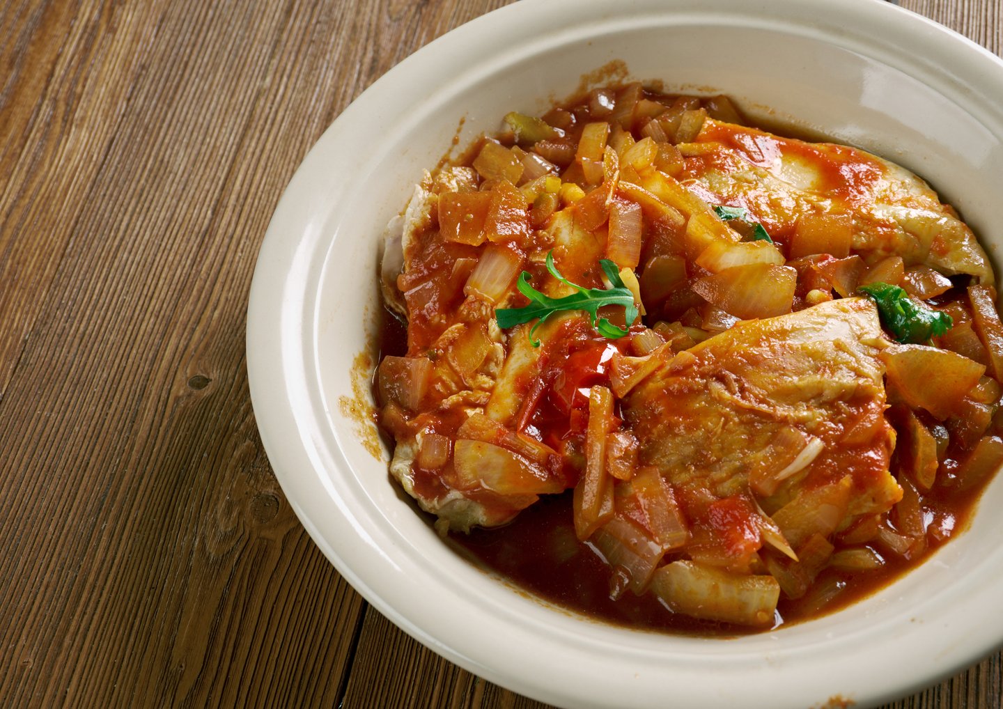 Belize-style stew chicken made with chicken and tomatoes