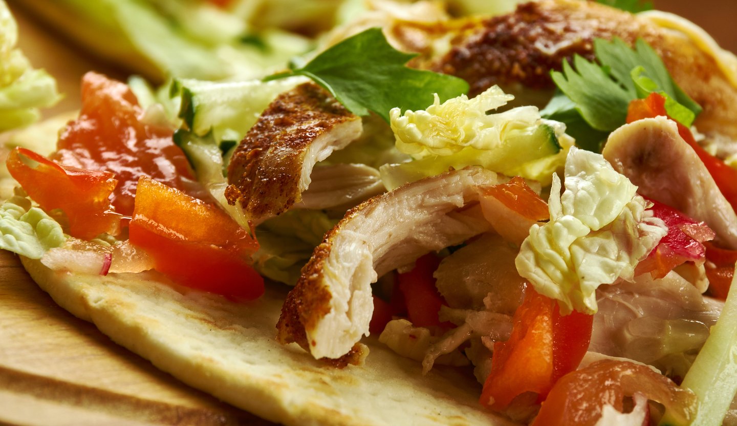 Close up of chicken and salad in Belizean salbutes