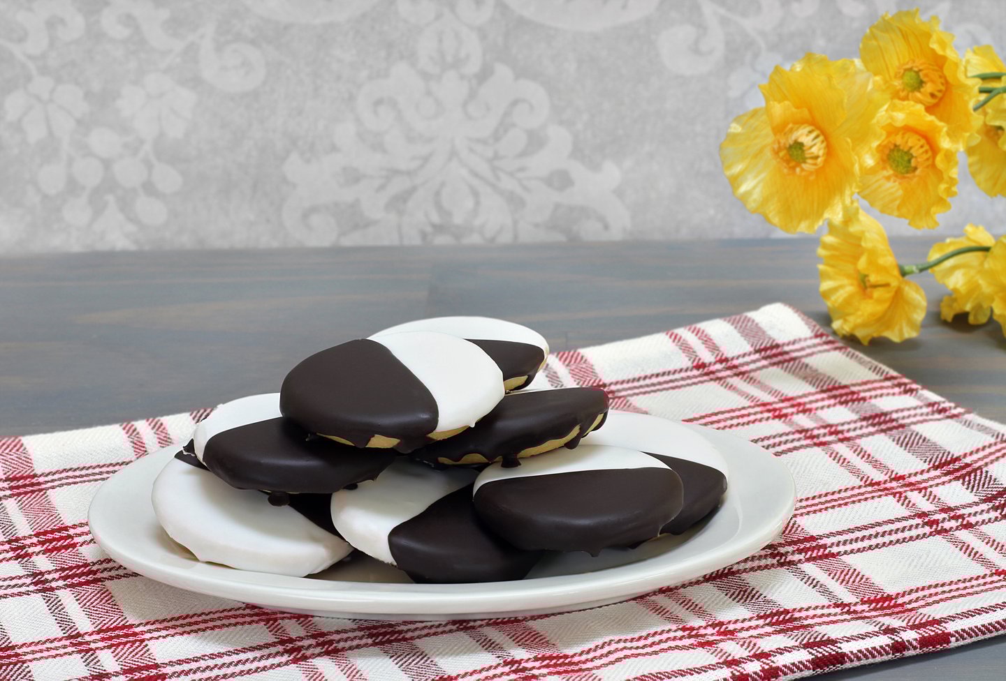 Black and white cookies piled on a plate