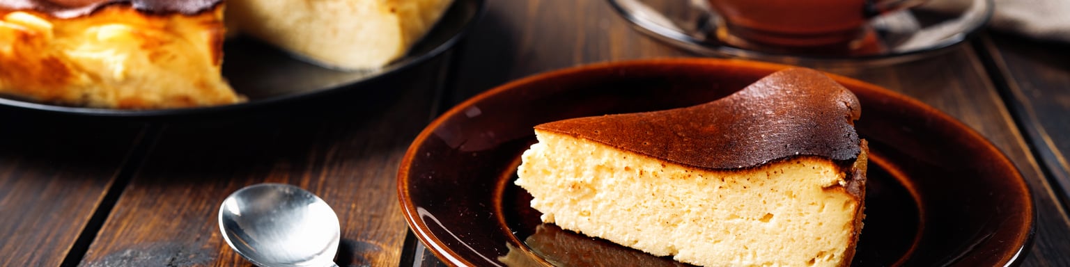 Slice of burnt Basque cheesecake