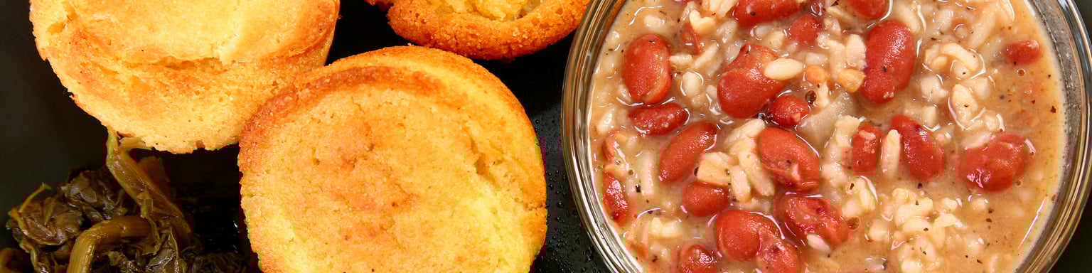 A platter of Cajun food including fish and red beans and rice
