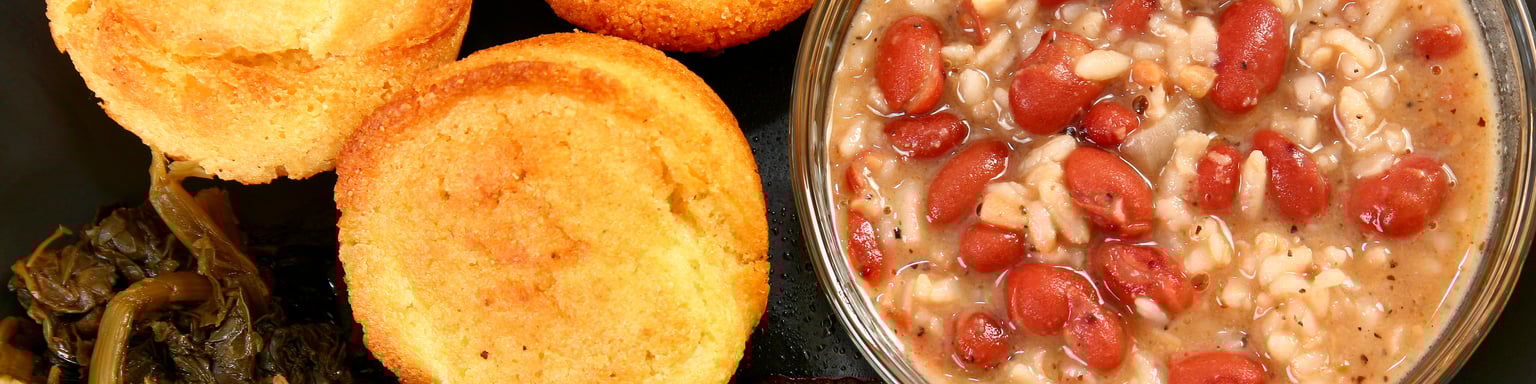 A platter of Cajun food including fish and red beans and rice