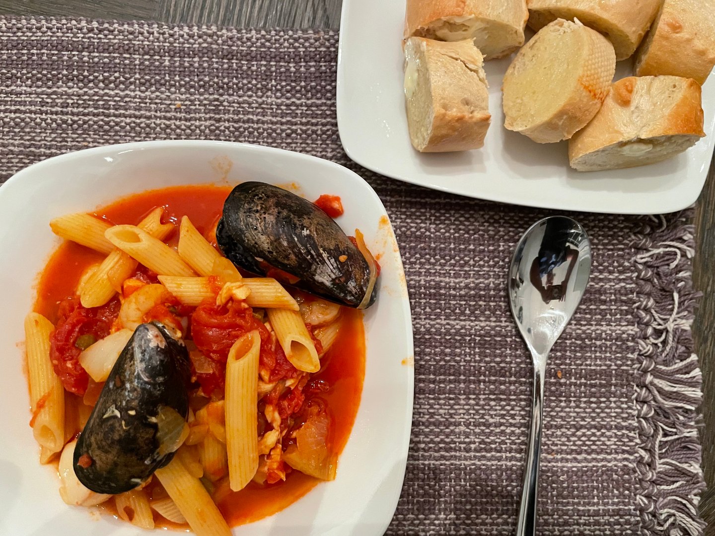 Cioppino stew served with crispy baguette