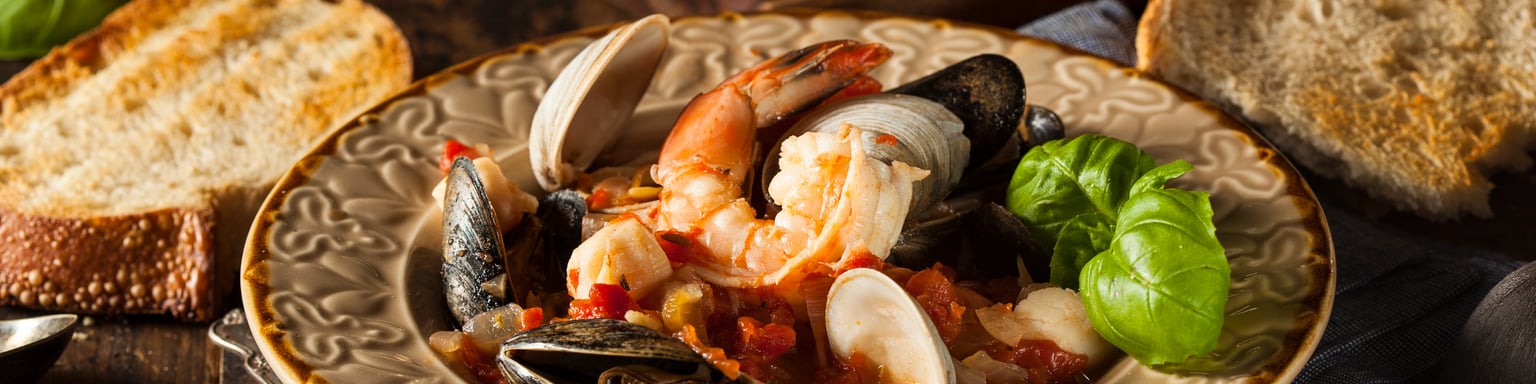 Cioppino seafood stew served with crusty bread