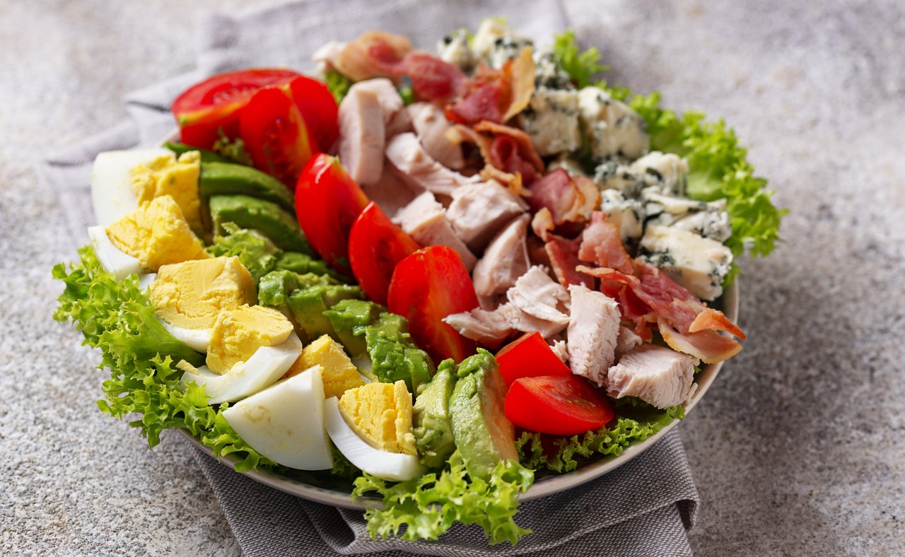 Cobb salad with ingredients displayed in sections