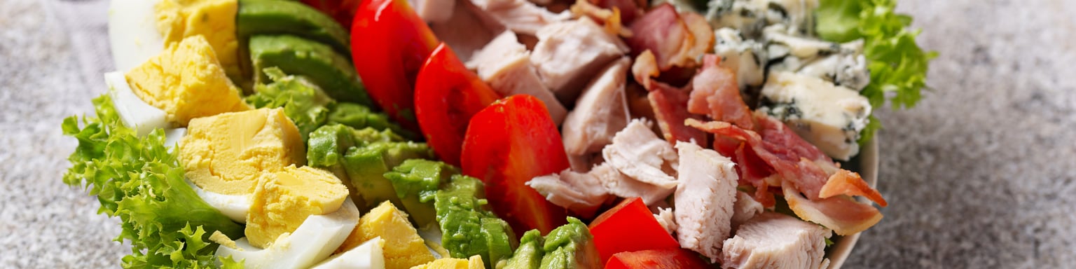 Cobb salad with ingredients displayed in sections
