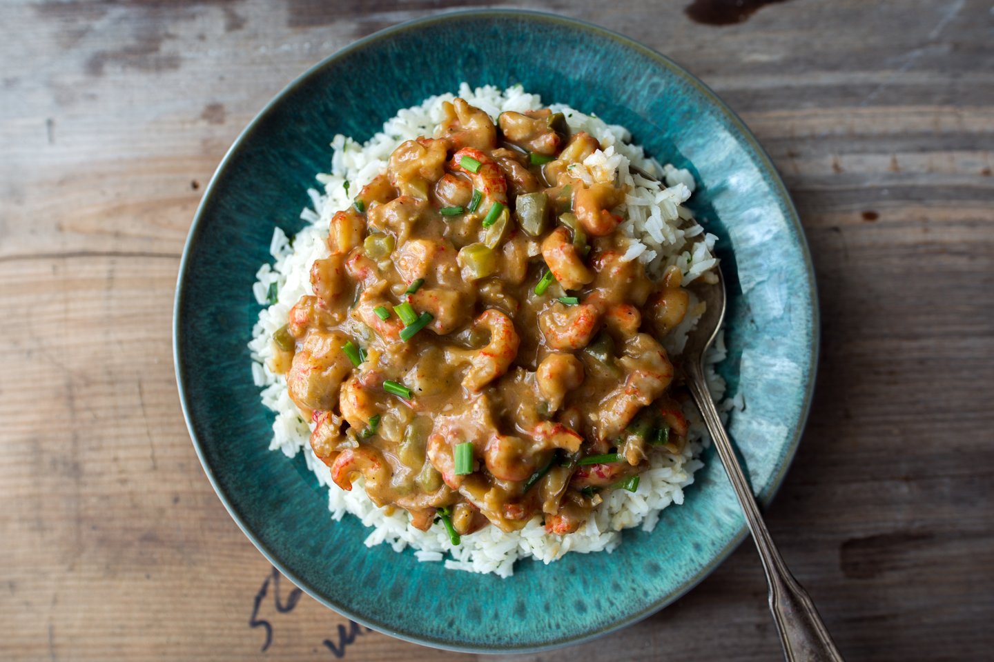 A plate of crawfish etouffee served over rice.