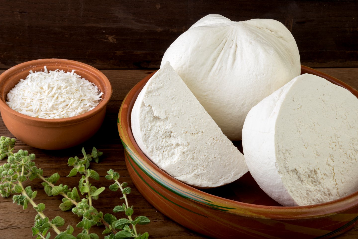 Chunks of mizithra, a whey cheese from Crete, with a bowl of grated mizithra