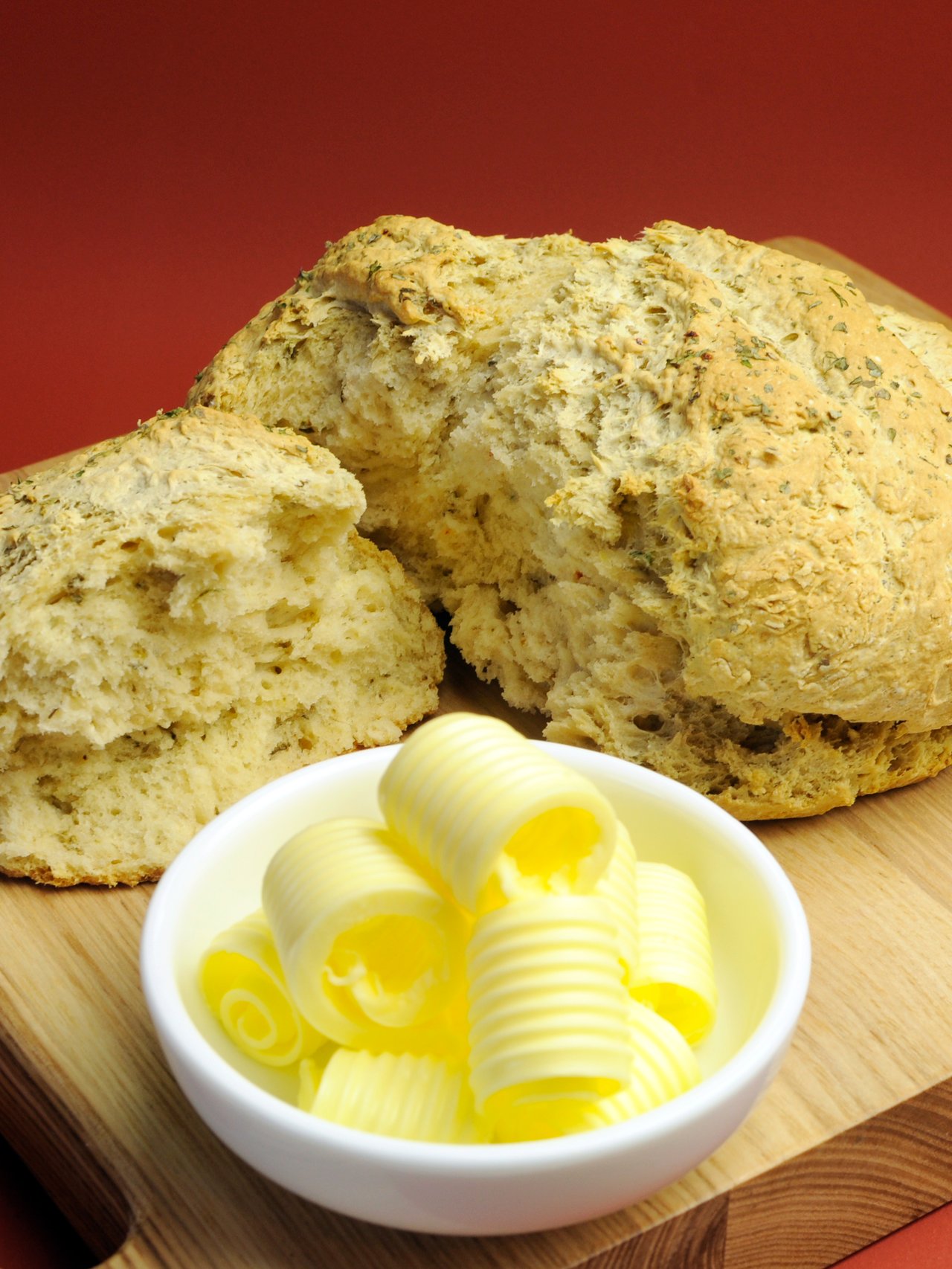 Damper bread on a board with butter