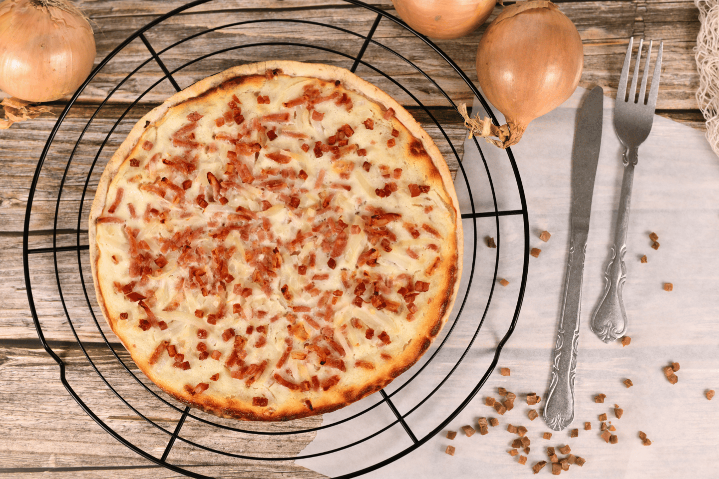 Taditional food 'Tarte Flambee' or 'Flammkuchen' from German-French Alsace border region.