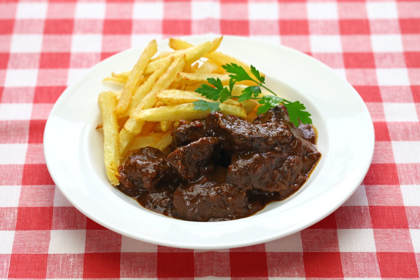 A plate of Flemish stew and fries