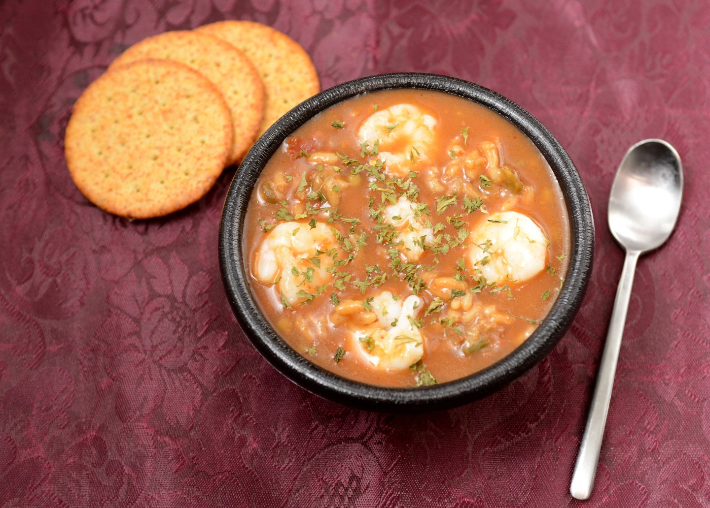 Shrimp gumbo with crackers in a restaurant in New Orleans