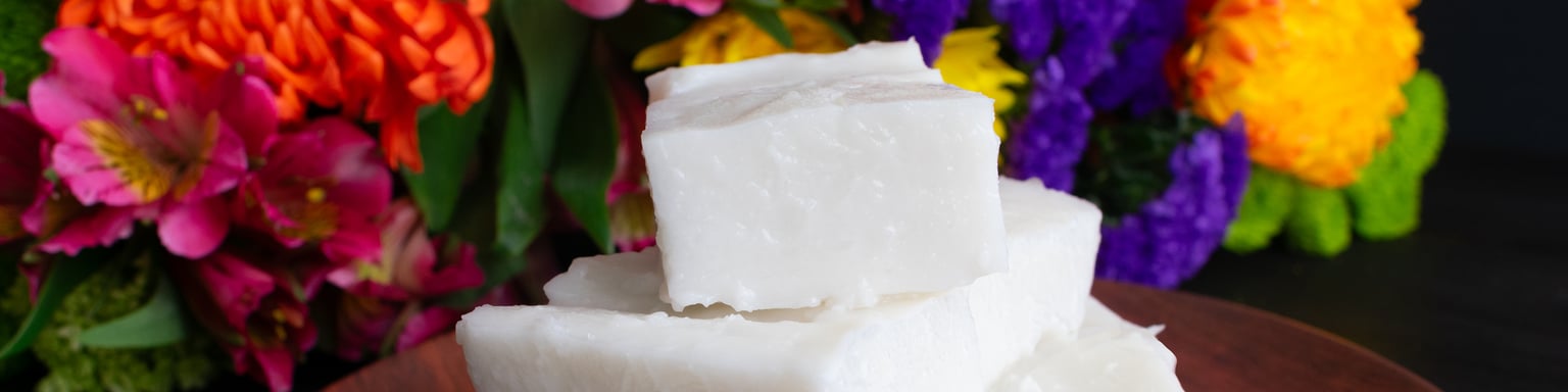 Haupia squares on a wooden plate.