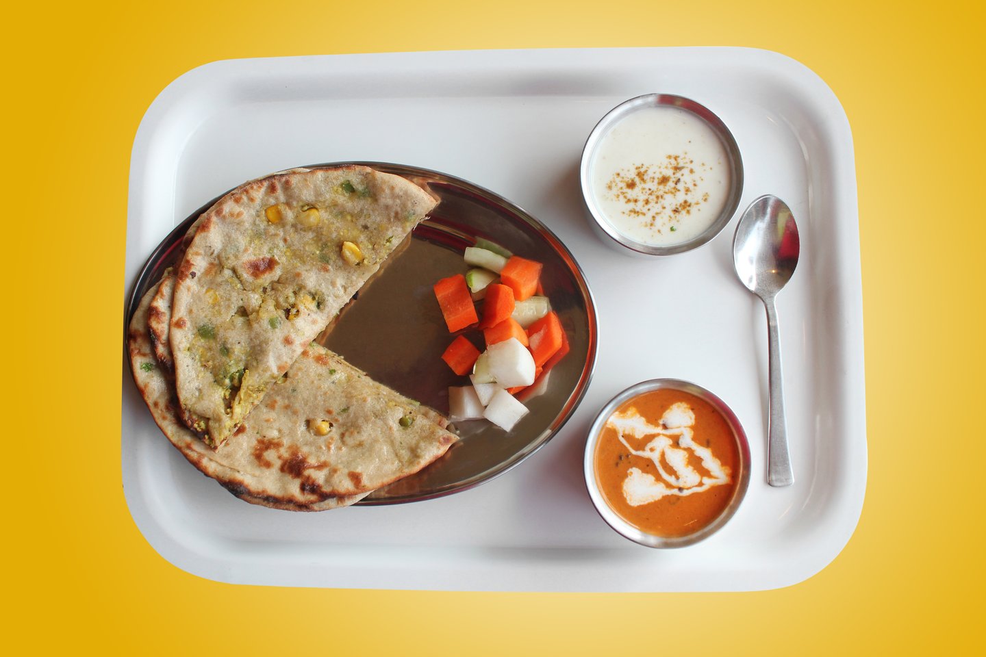 Parathas stuffed with vegetables and served with dipping sauces