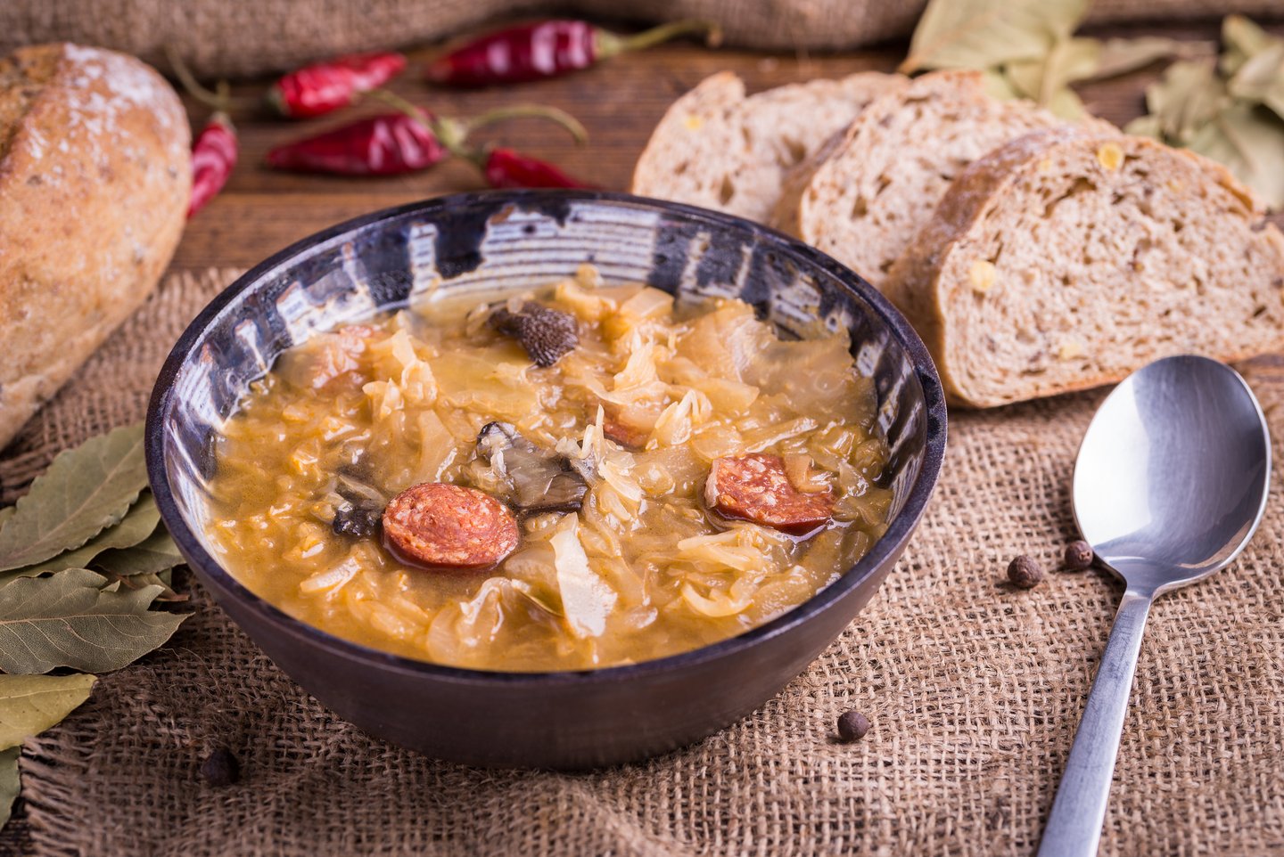 A bowl of traditional Kapustnica, a Slovak cabbage soup, served with bread
