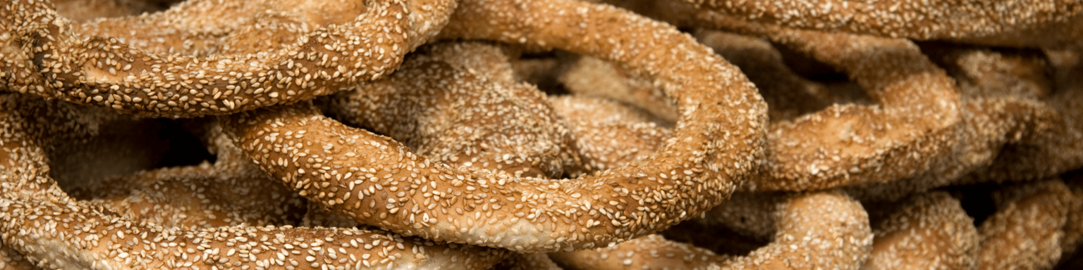 Freshly baked koulouri on a stand in Greece