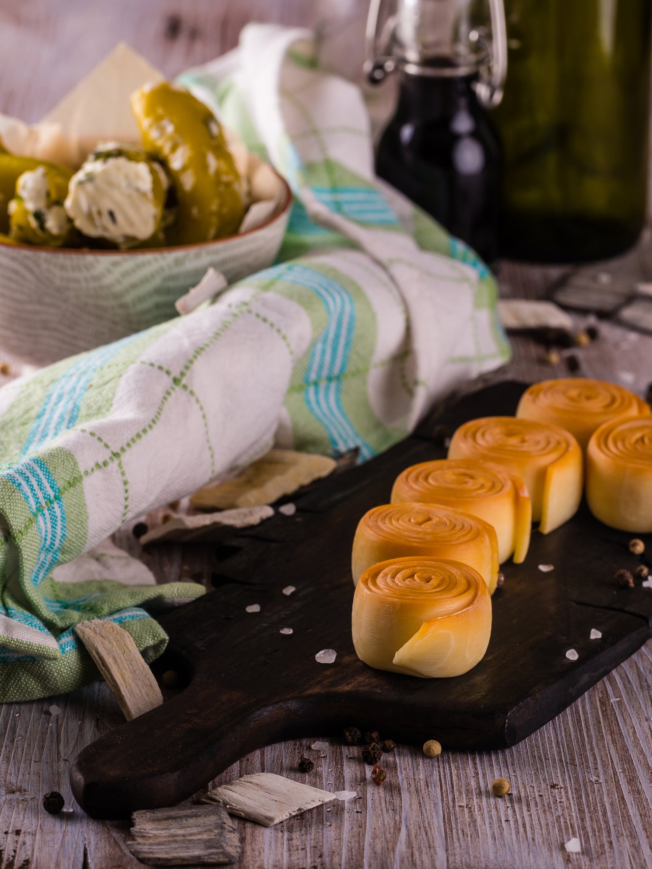 Rolls of parenica cheese on a chopping board
