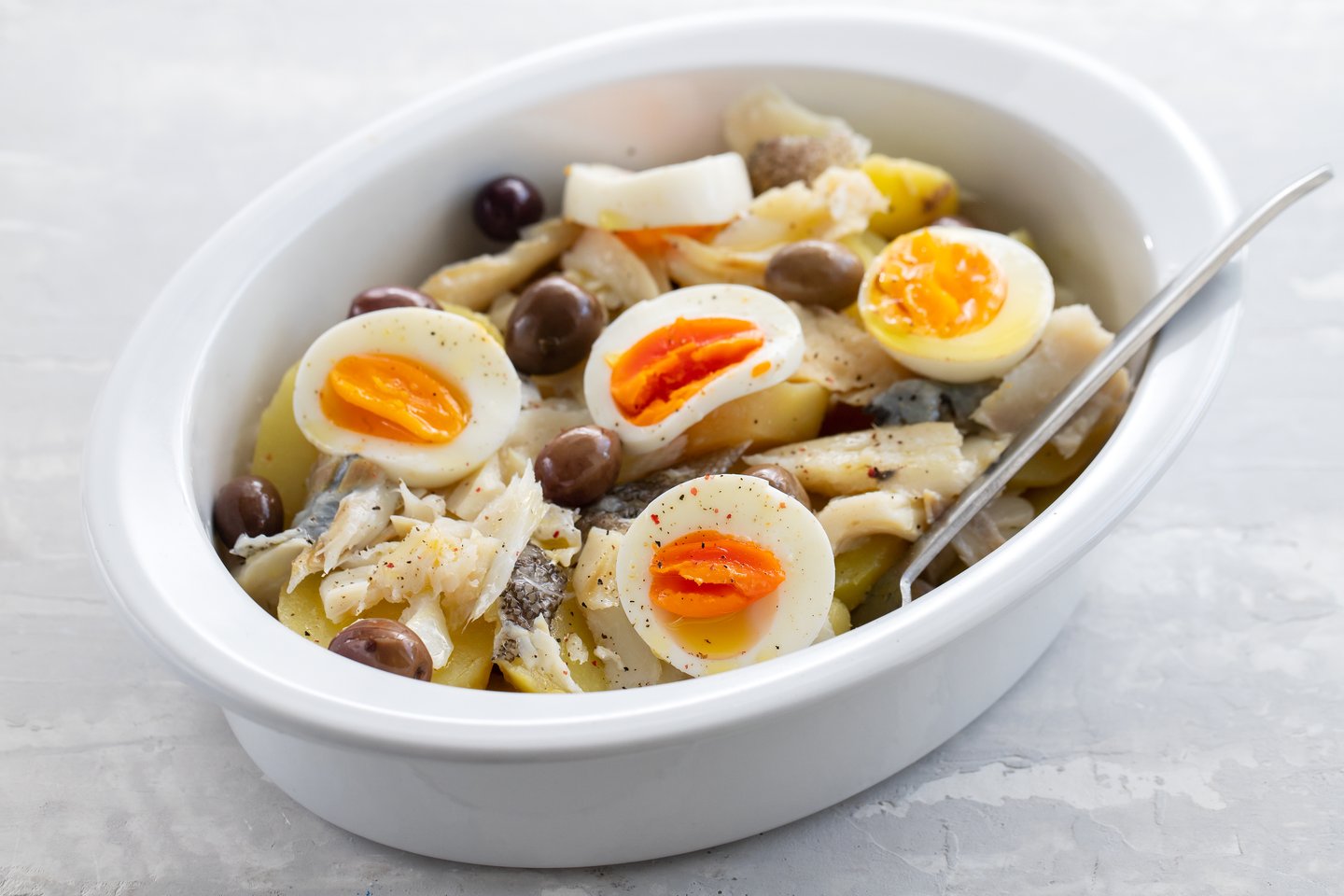 Bacalhau, a typical portuguese dish codfish with potato and egg