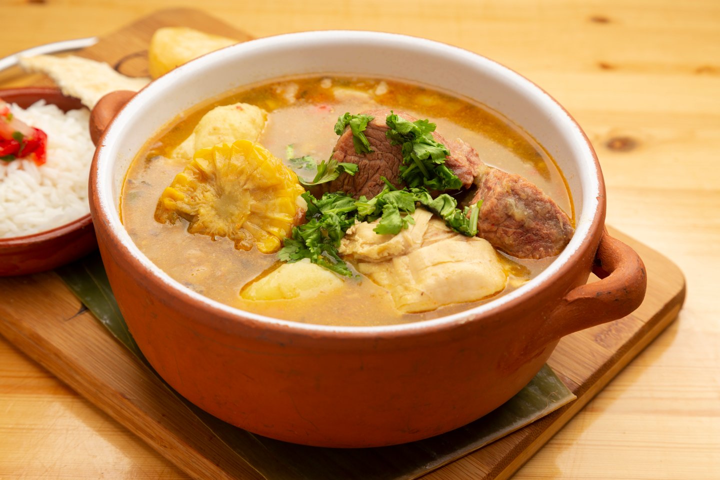 Sancocho, a traditional Colombian stew, with rice on the side