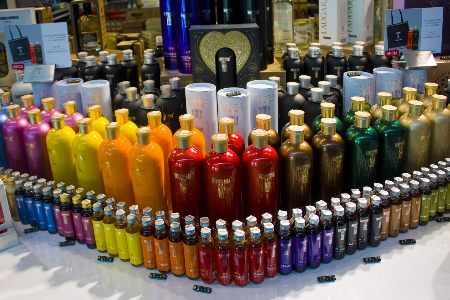A display of brightly-coloured Tatratea bottles in Bratislava