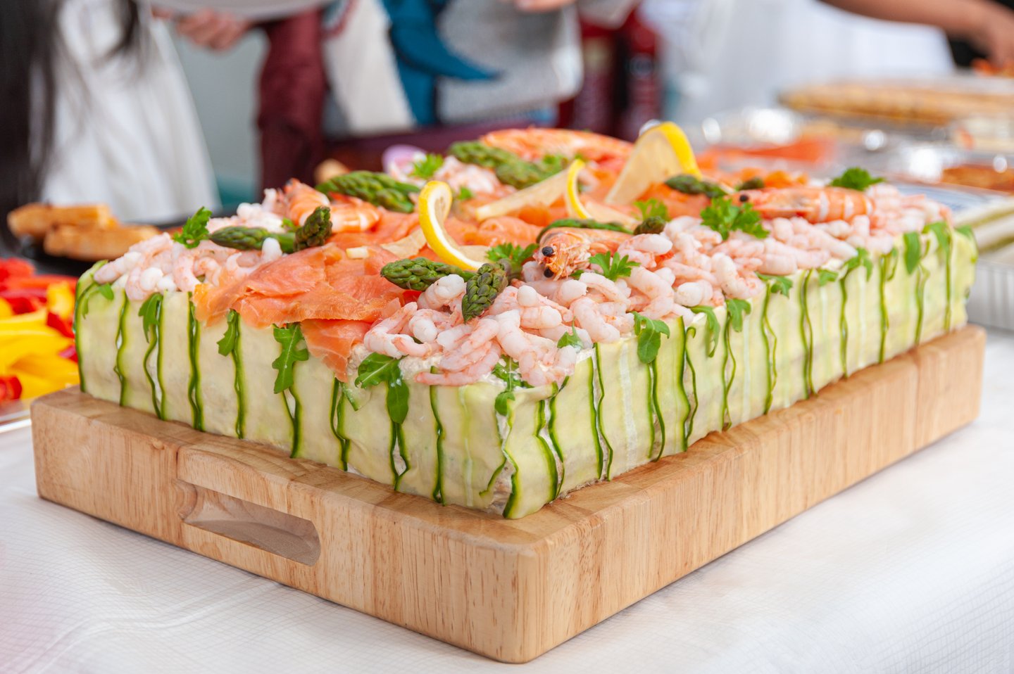 A traditional seafood smorgastorta topped with shrimps, salmon and asparagus