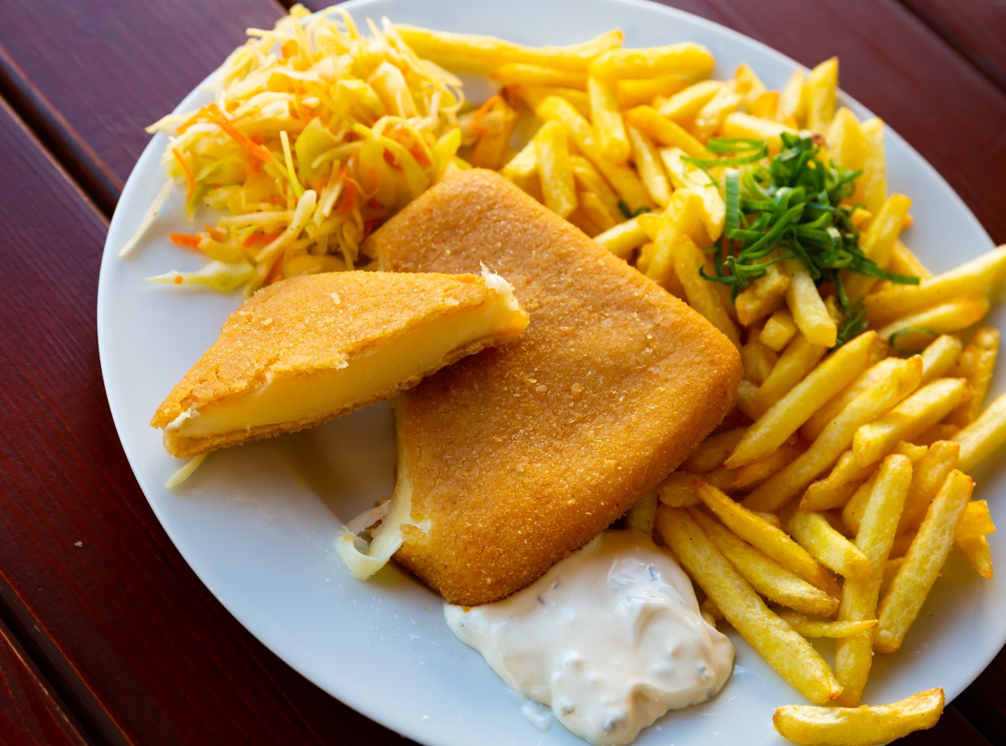 Vyprážaný syr (deep fried cheese) served with fries and tartar sauce