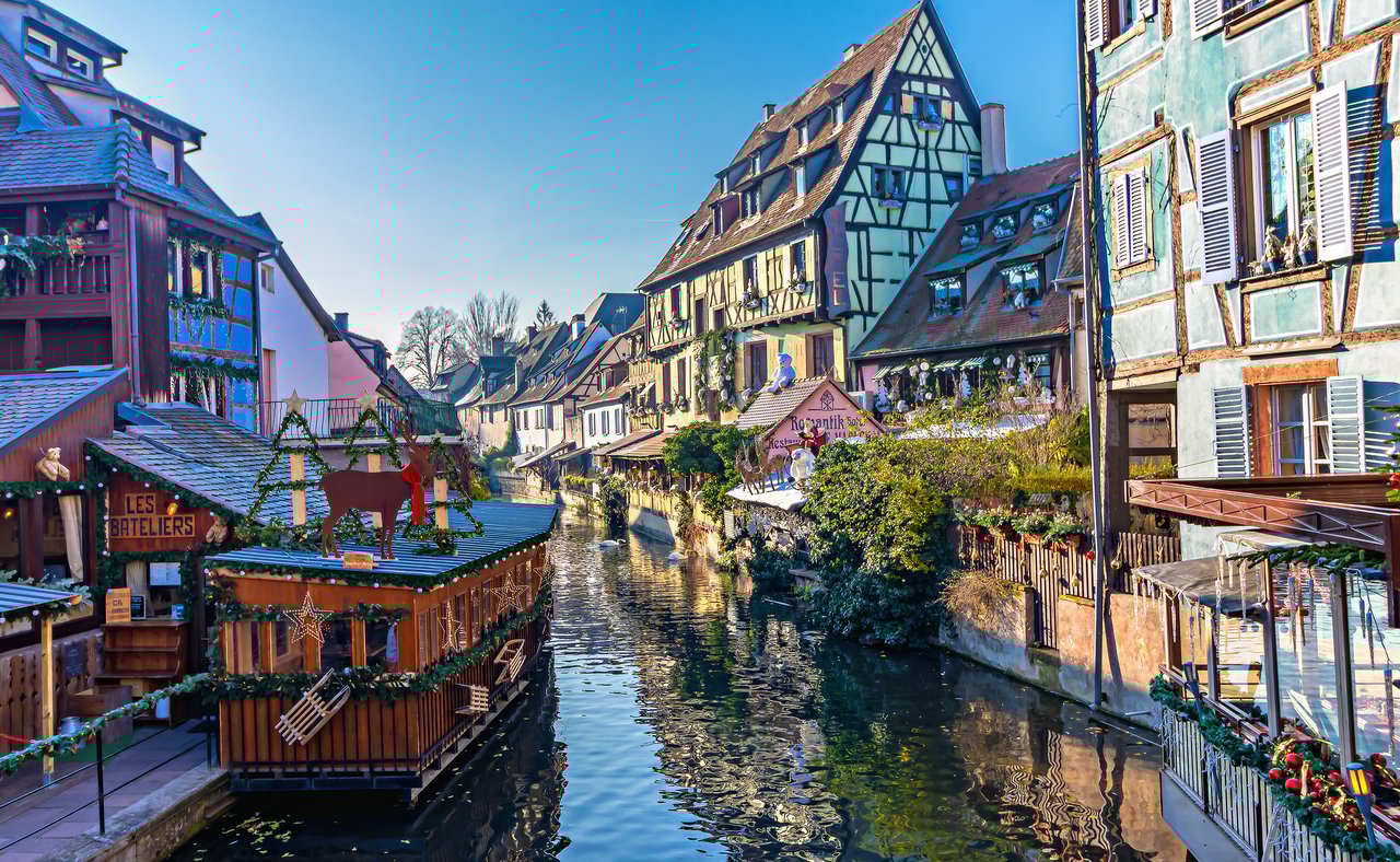 Houses along a canal in Colmar decorated for Christmas