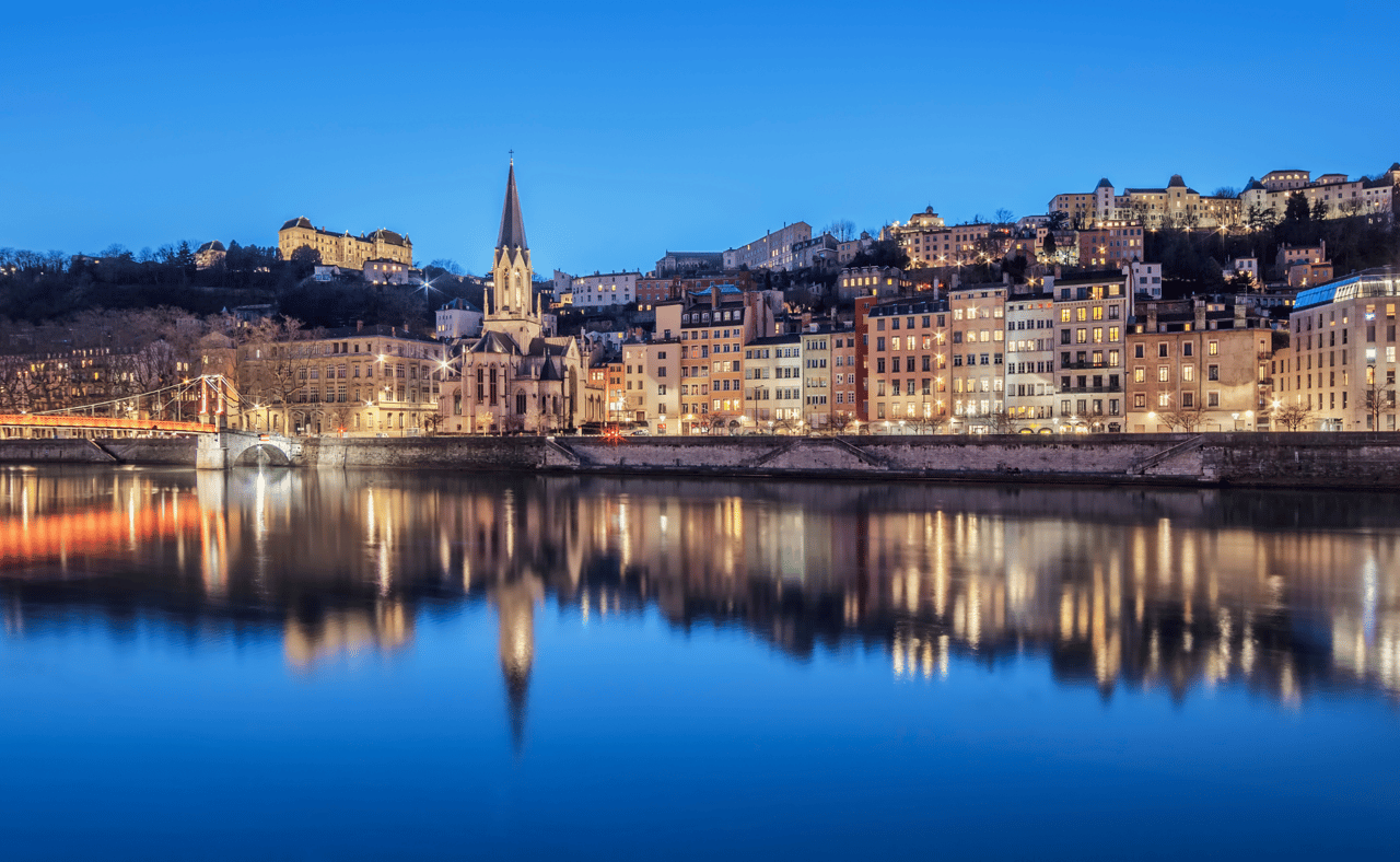 Panoramic view of Lyon with Saone river by night, France.