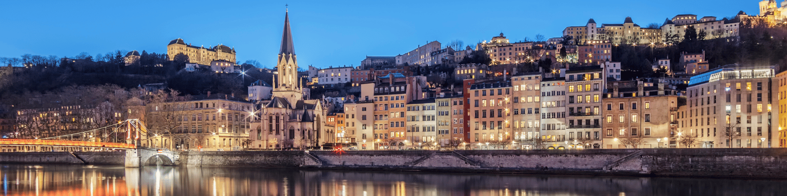 Panoramic view of Lyon with Saone river by night, France.