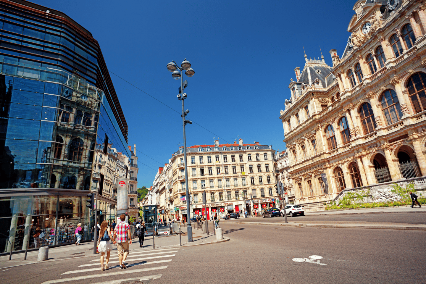 People walk on Place des Cordeliers square in the center of Lyon. 