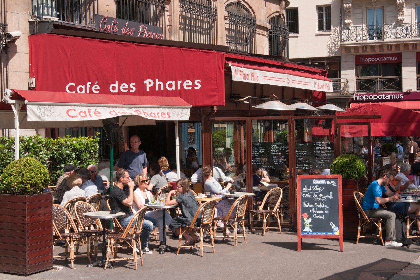 People sitting at a cafe in Paris, France