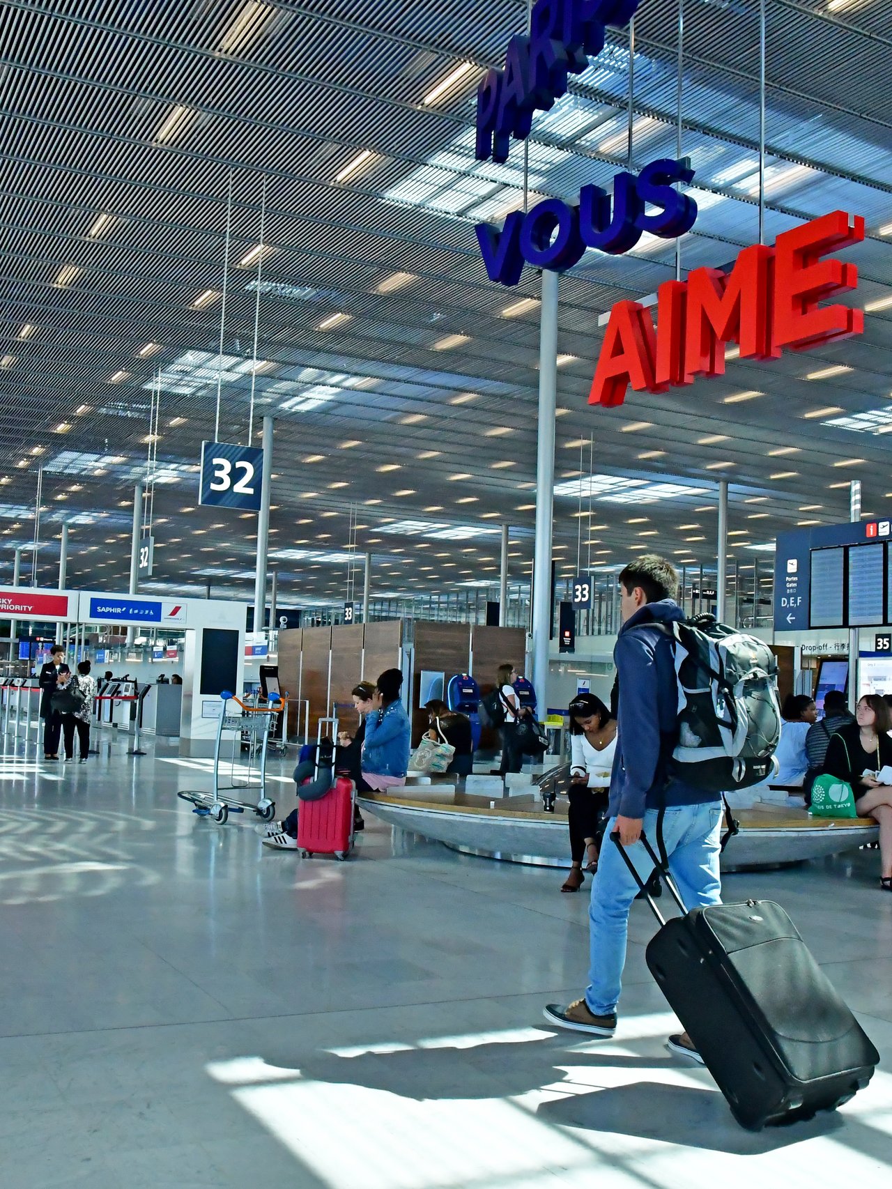 People with bags at Paris Orly airport in France.