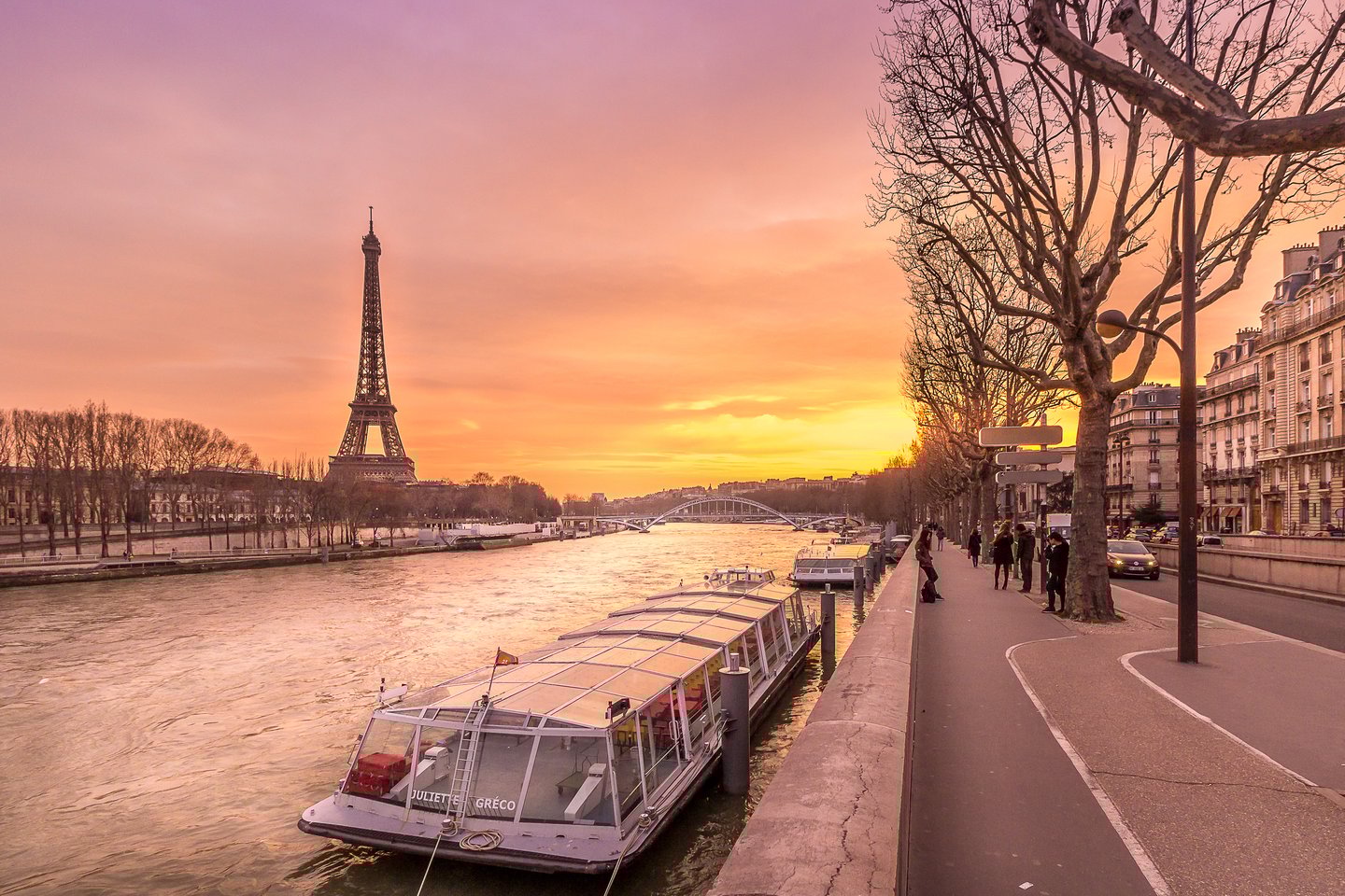 The Seine River with the Eiffel Tower in the distance at sunset in winter