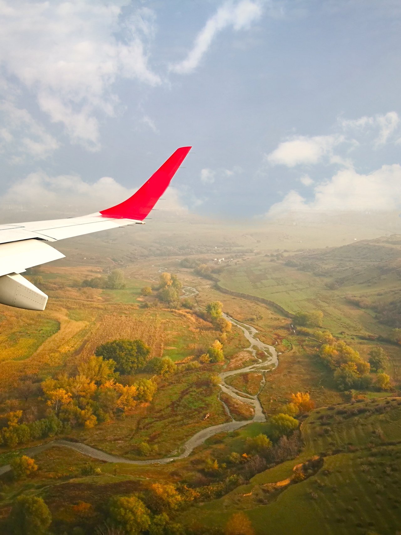 The Georgian countryside from a plane with the wing visible.